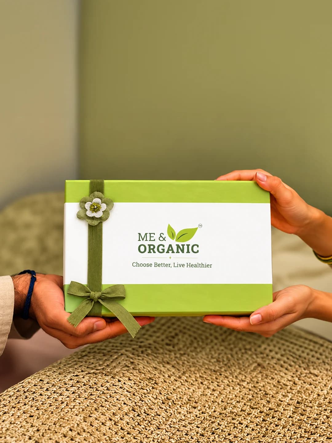 Ribbon-wrapped Me & Organic gift box being shared