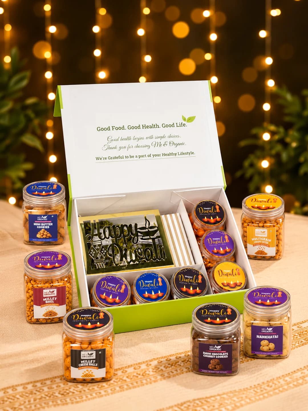 Me & Organic festive hamper with assorted snack jars and a Diwali greeting