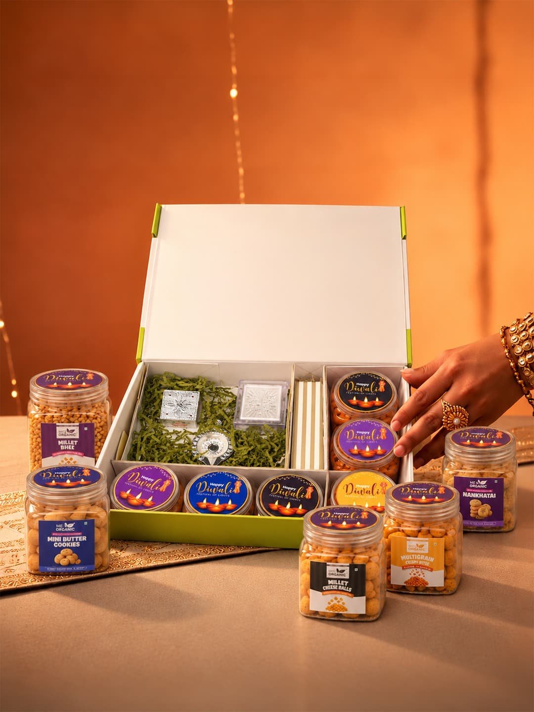 Open Diwali hamper with Me & Organic snack jars and festive keepsakes